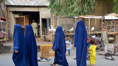 Women walk along a street in Kandahar, southern Afghanistan. AFP