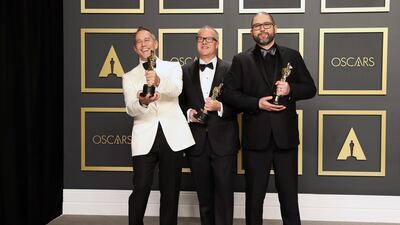 Jonas Rivera, Mark Nielsen and Josh Cooley pose in the press room with the Oscar for Best Animated Feature Film for 'Toy Story 4' at the 92nd Academy Awards on Sunday, February 9. EPA