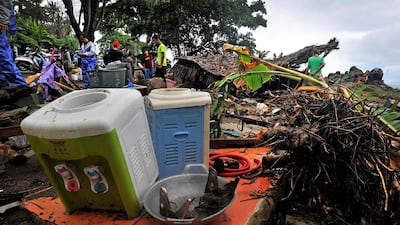 Residents search for victims among the ruins of collapsed houses. Reuters