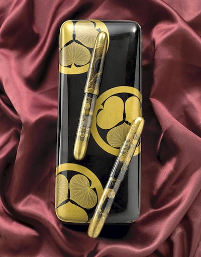 Dunhill Namiki Golden Tiger and Black Cat. Courtesy Bonhams
