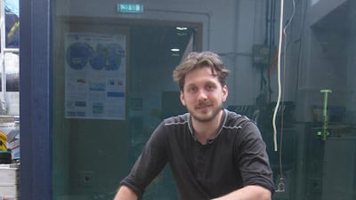 Dr Bastien Queste, from University of East Anglia in Norwich, pictured with a' sea glider', which has been deployed in the Arabian Sea. Daniel Bardsley for The National