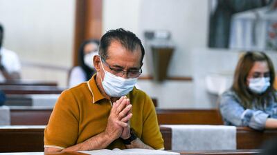 The faithful wearing masks will sing hymns and recite prayers during masses scheduled on Christmas Eve and Christmas Day.