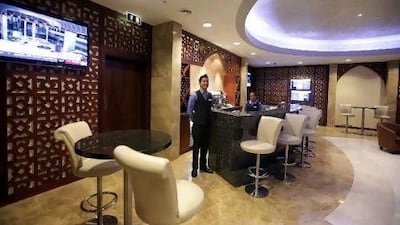 Guests can nibble hors d'oeuvres and play video games in the new business lounge at Abu Dhabi Airport's Terminal 1.