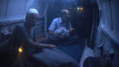 A Syrian man holds a wounded Syrian girl in the back of an van as they head for treatment at the Unified Medical Office for Douma, a make-shift medical centre in the rebel-held town of Douma, northeast of the capital Damascus, Syria. Abd Doumany / AFP