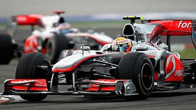 Lewis Hamilton of McLaren leads from teammate Jenson Button on his way to winning the Turkish Grand Prix.