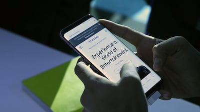 A visitor checks out the new Samsung Galaxy S8 during the launch event in Dubai. Satish Kumar / The National