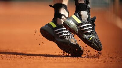 The shoes of Andy Murray of Britain in action against Nick Kyrgios of Australia during their third round match for the French Open tennis tournament at Roland Garros in Paris, France, 30 May 2015. EPA/ETIENNE LAURENT