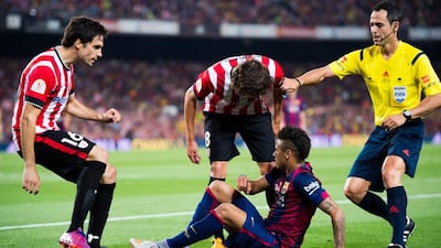 Xabier Etxeita, left, and Ander Iturraspe, centre, of Athletic Club argue with Neymar of Barcelona next to referee Carlos Velasco Carballo during the Copa del Rey final at Camp Nou on May 30, 2015 in Barcelona, Spain. (Photo by Alex Caparros/Getty Images)