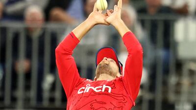 England's Dawid Malan takes a catch to dismiss Australia batter Marcus Stoinis for 35. AFP