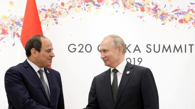 Russian President Vladimir Putin shakes hands with Egyptian President Abdel Fattah El Sisi during a meeting on the sidelines of the G20 summit in Osaka. Reuters