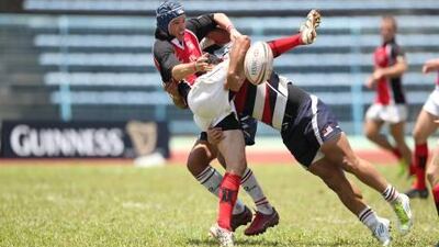 UAE captain Tim Fletcher is tackled during the match against Malaysia in Borneo.