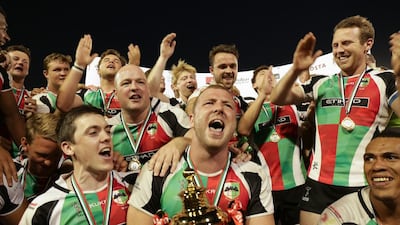 Ben Bolger, front and centre, and his Abu Dhabi Harlequins teammates celebrate after beating Jebel Ali Dragons to win the UAE Premiership. Victor Besa for The National