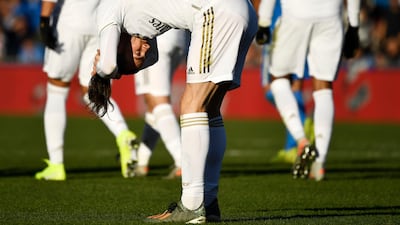 Real Madrid forward Gareth Bale arranges his ponytail. AFP