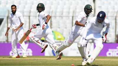 Tamim Iqbal, second left, led the Bangladesh response with a 78-run innings before being dismissed by Gareth Batty. Dibyangshu Sarkar / AFP