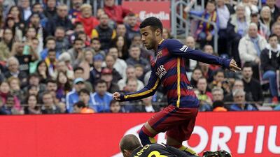 FC Barcelona’s Brazilian midfielder Rafinha (up) scores his goal in front of goalkeeper Peu Lopez (down) of RCD Espanyol during their La Liga match played at Camp Nou stadium in Barcelona, Catalonia, Spain on 08 May 2016. Alberto Estevez / EPA