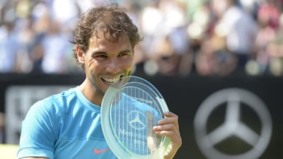 Spain's Rafael Nadal poses with the Mercedes Cup trophy, his second piece of silverware this year. Thomas Kienzle / AFP