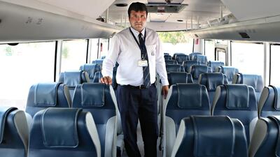 Muneer Hussain, with the Bright Bus Transport, follows a strict checklist daily to ensure the safety of his vehicle. Delores Johnson / The National