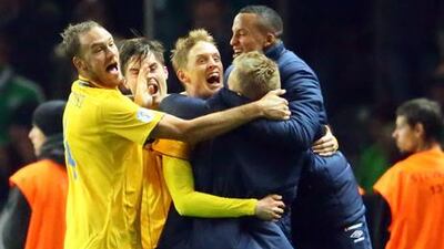 Sweden's Rasmus Elm celebrates his late equaliser against Germany with teammates