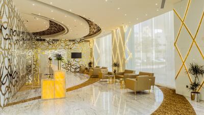 The gold-themed lobby of the Gevora Hotel.