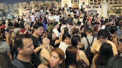 People gathered to see Burj Khalifa projecting the Philippine flag.