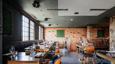 The interior decor of exposed brick and wood works at Folly by Nick and Scott, which has replaced Rivington Grill. Courtesy Folly by Nick and Scott
