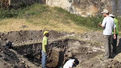 Dr Timothy Power, an assistant professor at Zayed University in Abu Dhabi, inspects a trench inside the 18th century Omani fortress in Stone Town, Zanzibar.