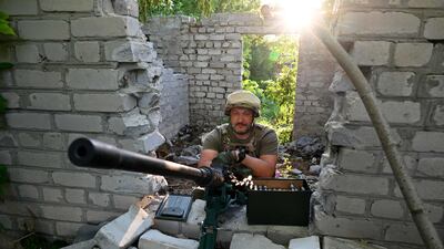 A Ukrainian serviceman keeps his position not far from the Ukrainian town of Chuguiv, in Kharkiv region. AFP