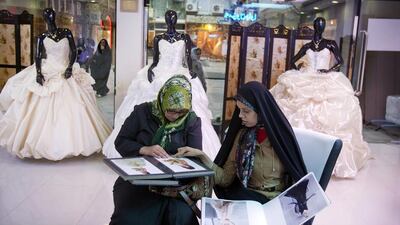 Iranian women shop for a bridal gown in Tehran. Maryam Rahmanian for The National
