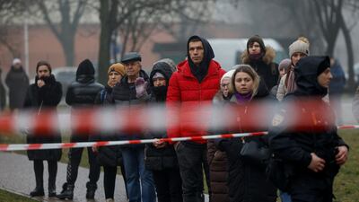 Onlookers gather at the scene. Reuters