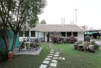 The garden of one of the villas in Desert Springs Village. Pawan Singh / The National