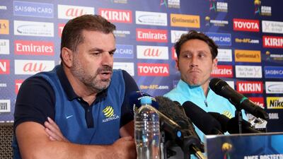 Australia manager Ange Postecoglou, left, and midfielder Mark Milligan discuss their pending 2018 World Cup qualifying play-off against Syria in Sydney. Rick Rycroft / AP Photo