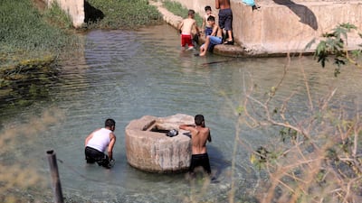 Palestinian boys swim in a spring at Al Faraa refugee camp, near the West Bank city of Nablus.