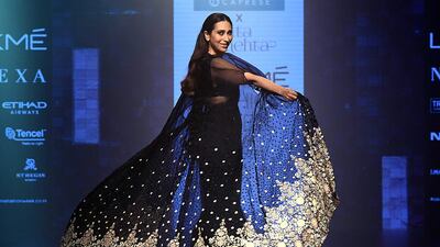 Actress Karishma Kapoor dons a sari for designer Arpita Mehta. AFP