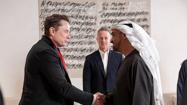 President Sheikh Mohamed greets Elon Musk before a meeting at Zayed National Museum. UAE Presidential Court