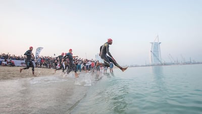 Participants taking part in Ironman Dubai at Jumeirah beach on Friday, February 7. Leslie Pableo for The National