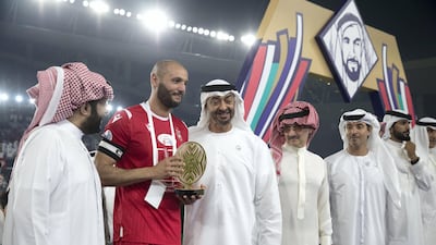 Sheikh Mohamed bin Zayed is photographed with Etoile du Sahel star Yassine Chikhaoui, Saudi businessman Prince Alwaleed bin Talal, and Sheikh Hazza bin Zayed. Mohammed Al Bloushi for Ministry of Presidential Affairs