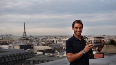 Spain's Rafael Nadal holds the Mousquetaires Cup (The Musketeers) during a photocall. AFP