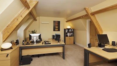 The second floor, which serves as a home office to the current owners, has three bedrooms with vaulted ceilings, access to the roof space and one bathroom. Courtesy Cheffins