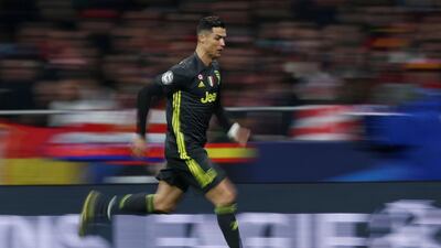 Cristiano Ronaldo runs with the ball against Atletico Madrid. Reuters