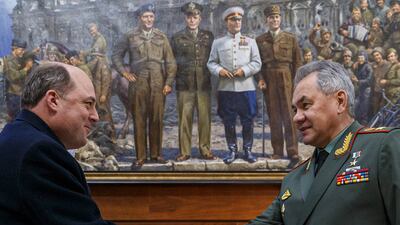 Mr Wallace and Russian Defence Minister Sergei Shoigu shake hands during their February meeting in Moscow. EPA