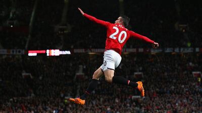 Robin van Persie of Manchester United celebrates scoring his team's third goal against Hull City on Tuesday. Alex Livesey / Getty Images / May 6, 2014