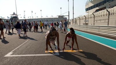 Abu Dhabi, United Arab Emirates, November 1, 2012: Fans take part in the pit walk day ahead of Formula 1 Etihad Airways Abu Dhabi Grand Prix at Yas Marina Circuit in Abu Dhabi on November 1, 2012. Christopher Pike / The National