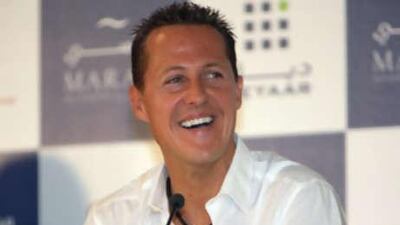The Formula One legend Michael Schumacher smiles during a press conference to announce the Michael Schumacher World Champion Tower during the Cityscape Dubai at Dubai International Exhibition Centre.