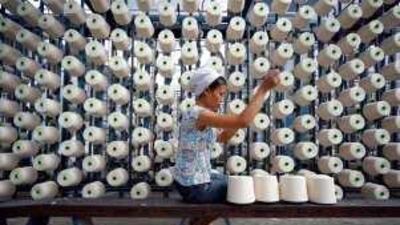 An employee works at a textile factory in Suining, Sichuan province.