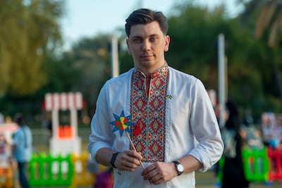 Yevheniy Semenov, a Ukrainian resident in Abu Dhabi of more than 11 years and vice president of the Ukrainian World Congress, at the Christmas gathering in Abu Dhabi last Saturday. He is holding a Christmas star. Ahmed Ramzan for The National