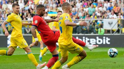 England's Kyle Walker scores his side's goal against Ukraine. AP