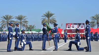 The graduating batch hands the Police College’s flag to the next batch