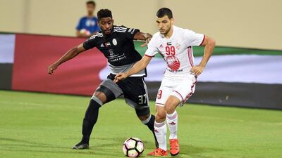Al Wahda, in black, put seven goals past Sharjah at the Sharjah Stadium in Round 6 of the Arabian Gulf League. Courtesy Arshad Khan / Pro League Committee