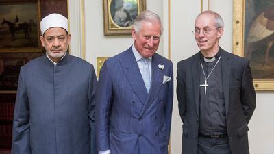 Britain's Prince Charles poses for a picture with Dr Al Tayeb and the Archbishop of Canterbury Justin Welby at Clarence House in London on June 11, 2015. AFP