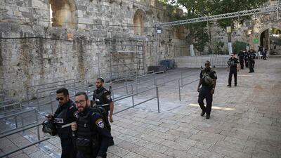 Israeli police officers walk outside the Al Aqsa mosque compound in Jerusalem's Old City on July 25, 2017. Israel has begun dismantling metal detectors it installed a week earlier at the gates of a contested Jerusalem shrine, amid widespread Muslim protests. Oded Balilty/AP Photo